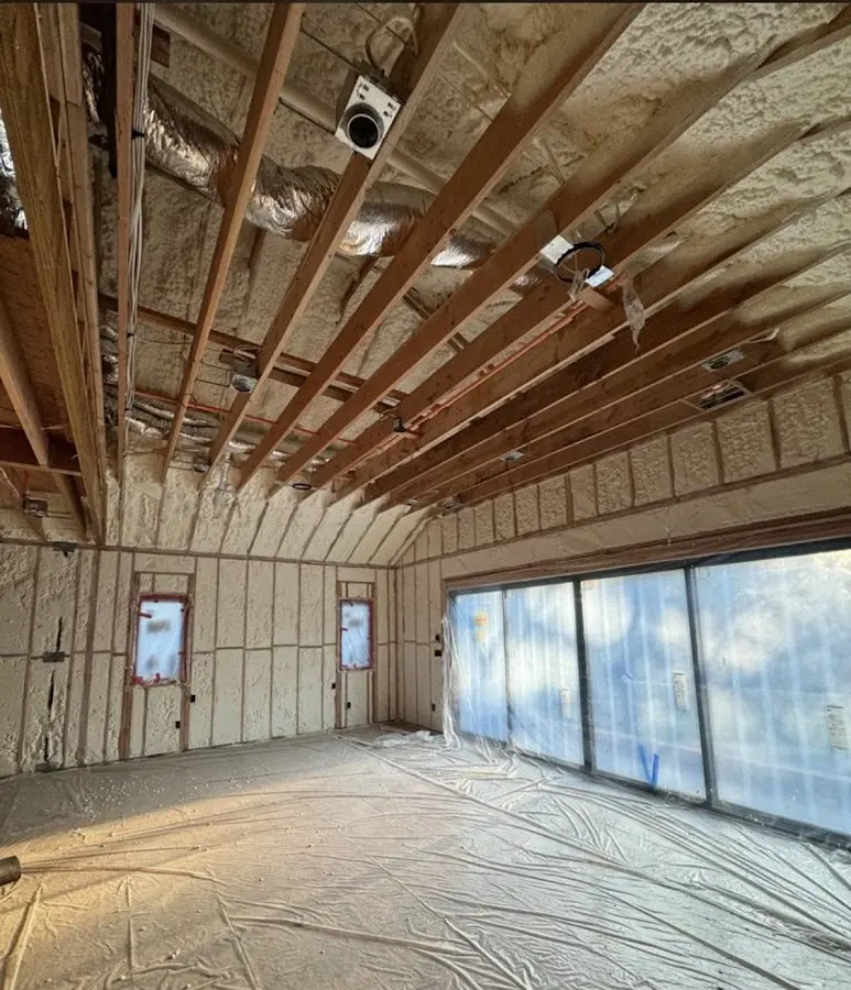 Interior walls and ceiling insulated with spray foam during new construction in Wheaton